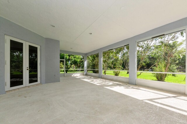 unfurnished sunroom featuring french doors