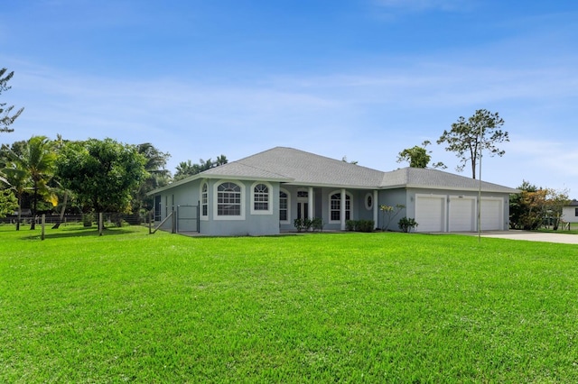 ranch-style home with a front lawn and a garage