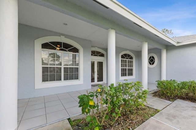 view of exterior entry featuring french doors