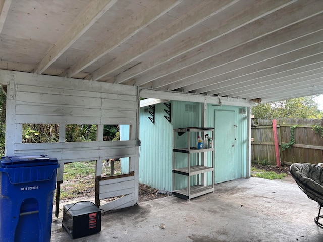 view of patio featuring a shed