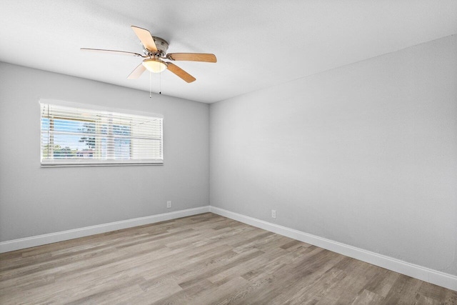 unfurnished room with light wood-type flooring and ceiling fan