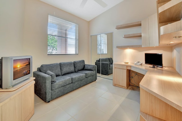 tiled office featuring built in desk, vaulted ceiling, and ceiling fan