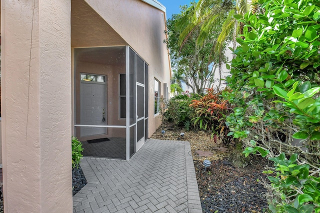 view of property exterior with a patio