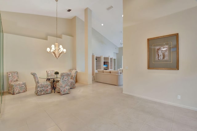 living area with a notable chandelier, high vaulted ceiling, and light tile patterned floors