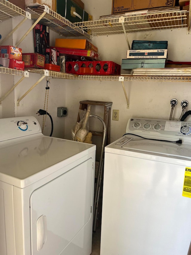 washroom featuring washer and dryer