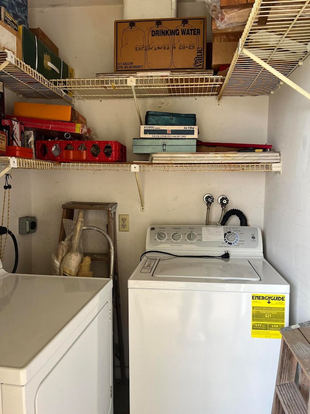 laundry area with washing machine and dryer