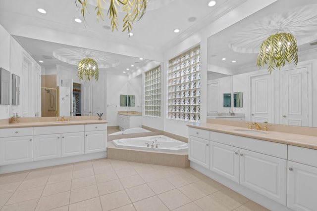 bathroom featuring tile patterned floors, vanity, a notable chandelier, and plus walk in shower