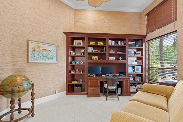 tiled home office with a towering ceiling and ornamental molding