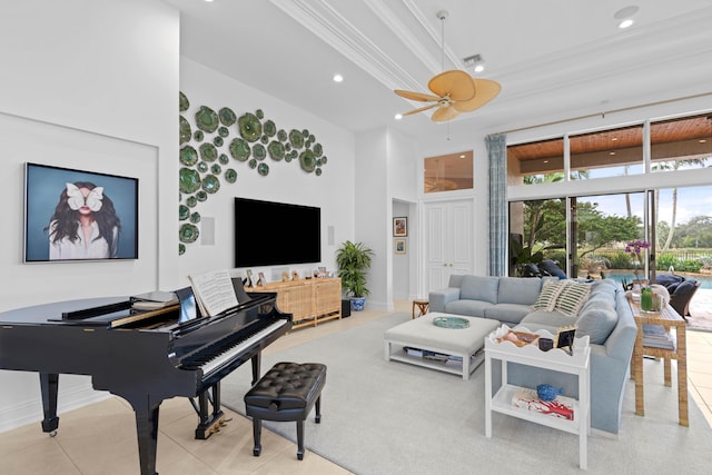 tiled living room featuring ceiling fan, crown molding, and a towering ceiling