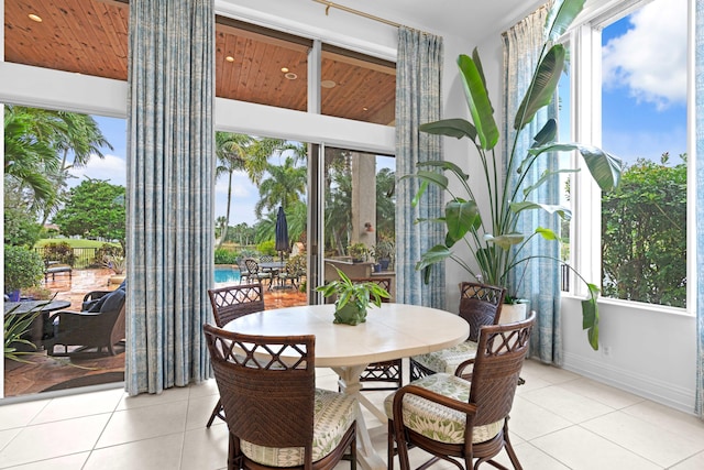 sunroom / solarium featuring wood ceiling