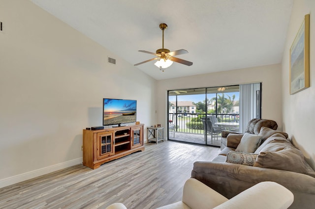 living room featuring light hardwood / wood-style floors, high vaulted ceiling, and ceiling fan