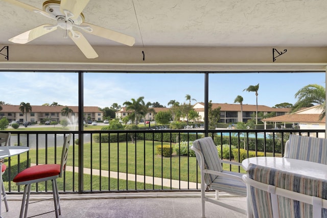 sunroom / solarium with ceiling fan