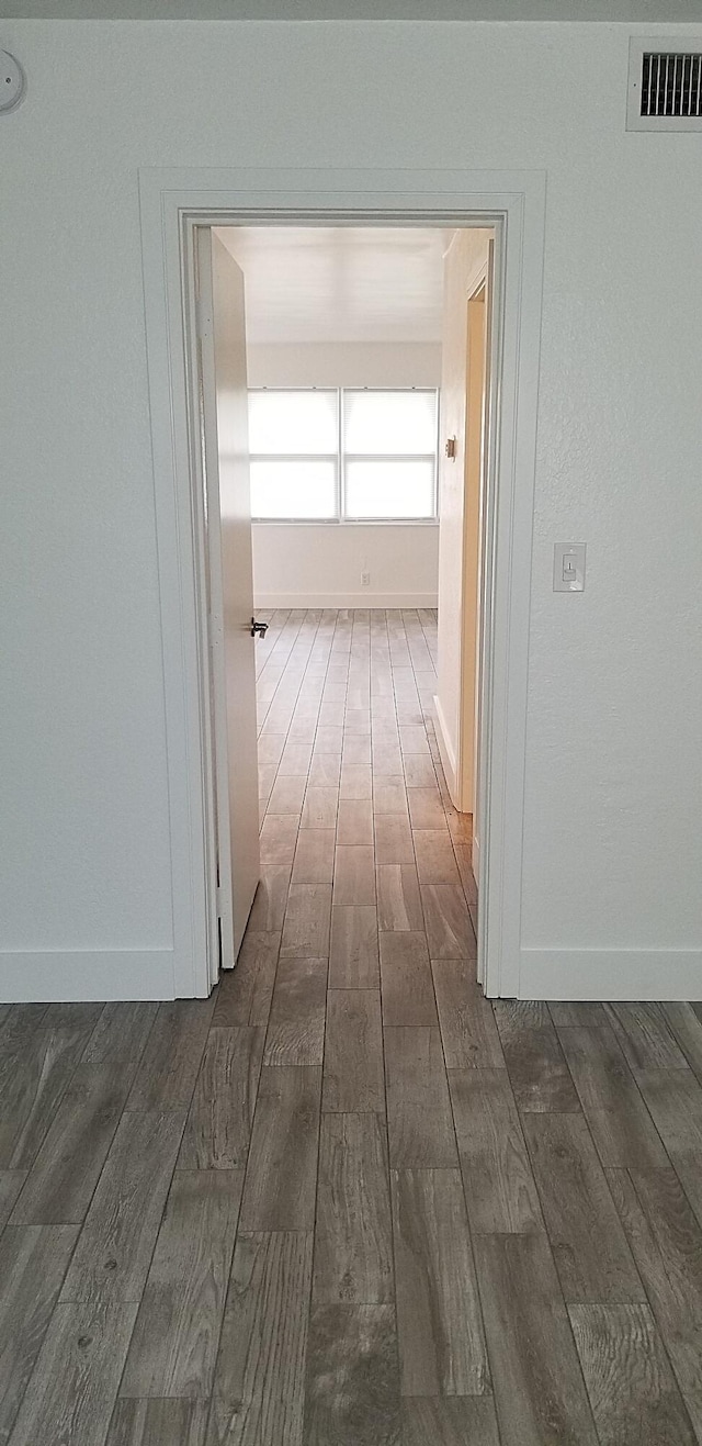 hall featuring dark wood-type flooring