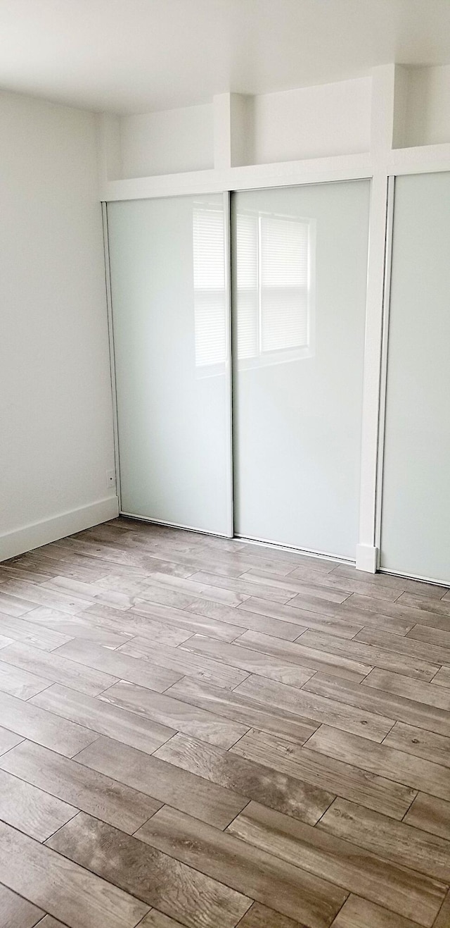 unfurnished bedroom with light hardwood / wood-style floors