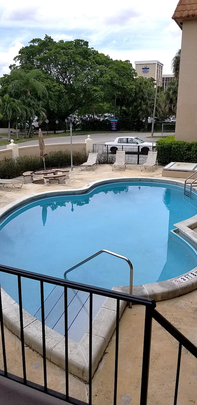 view of pool featuring a patio area