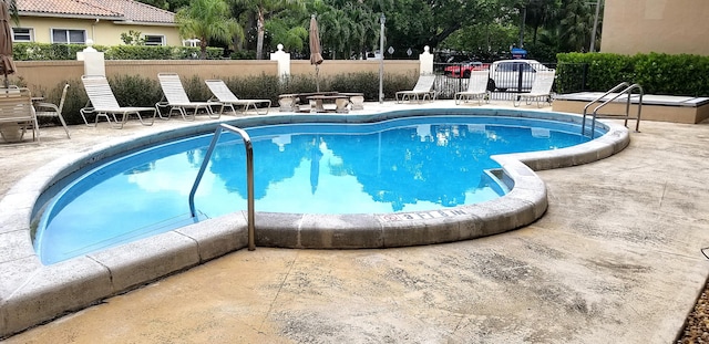 view of pool featuring a patio