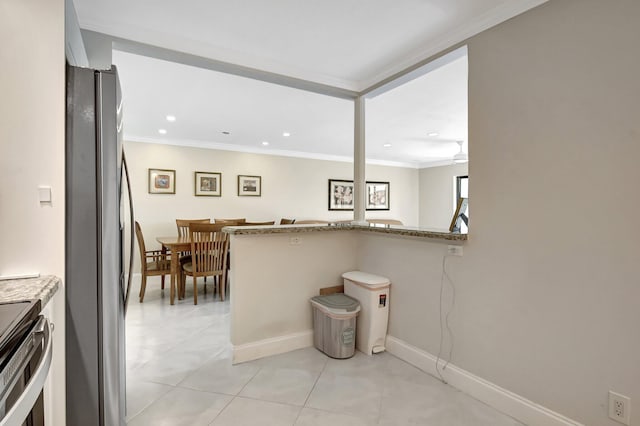 kitchen with crown molding, light tile patterned floors, appliances with stainless steel finishes, light stone counters, and kitchen peninsula