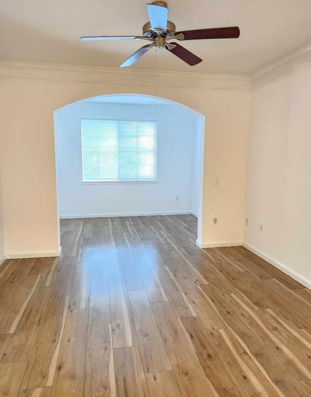 unfurnished room with hardwood / wood-style floors, ceiling fan, and crown molding