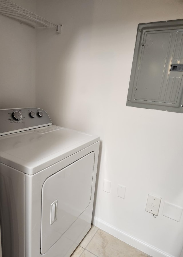 washroom featuring electric panel, light tile patterned flooring, and washer / dryer