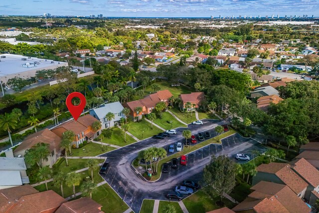 birds eye view of property with a residential view