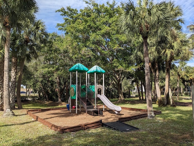 community playground featuring a lawn