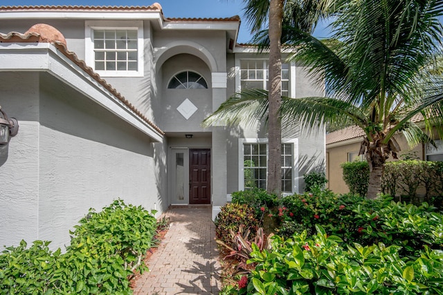 5353 Grand Banks Blvd, Greenacres, FL 33463 - doorway to property featuring stucco siding and a tile roof