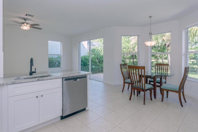 kitchen featuring sink, light stone counters, decorative light fixtures, white cabinets, and dishwasher