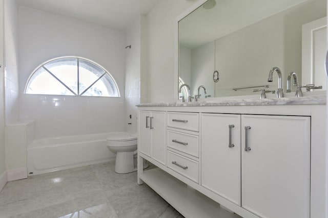 full bathroom featuring toilet, vanity, and bathing tub / shower combination