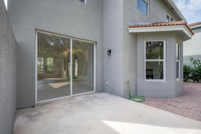5353 Grand Banks Blvd, Greenacres, FL 33463 - back of house featuring stucco siding and a patio area