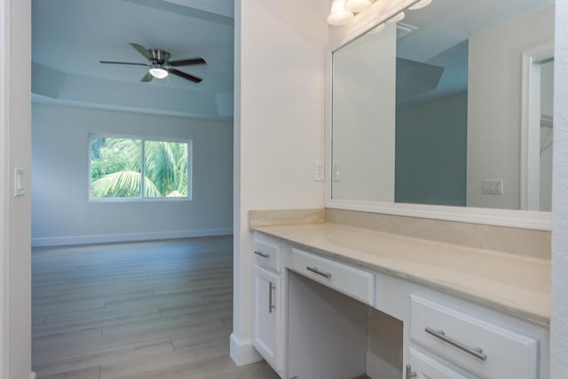 bathroom with vanity, hardwood / wood-style flooring, and ceiling fan