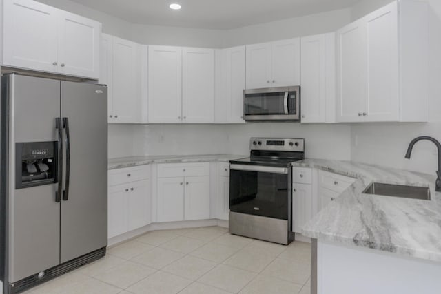 kitchen featuring white cabinetry, sink, and stainless steel appliances