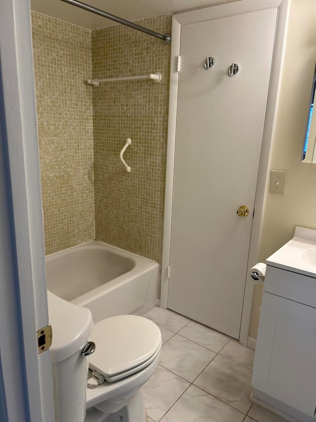 full bathroom with vanity, toilet, and tiled shower / bath combo