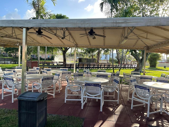 surrounding community with a gazebo and a yard