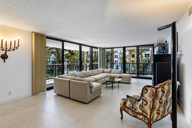 living room featuring a textured ceiling and expansive windows