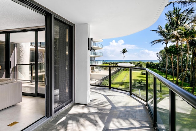 balcony featuring a water view