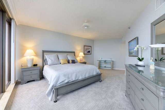 bedroom featuring light colored carpet