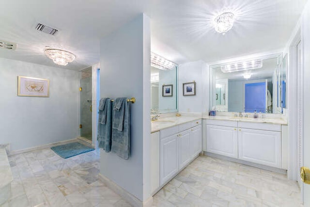 bathroom featuring vanity and walk in shower