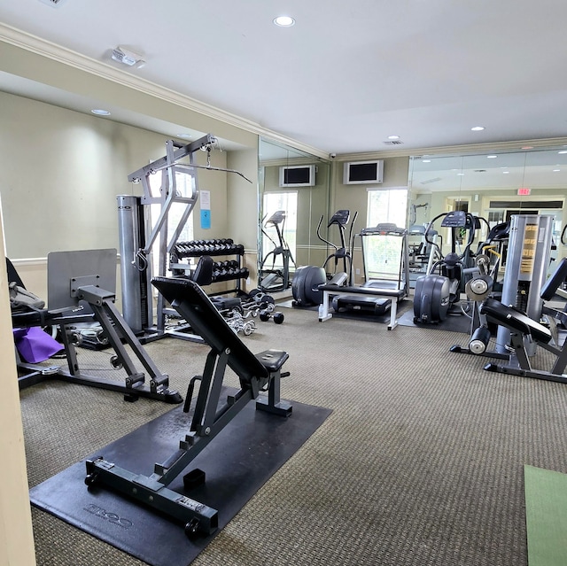 workout area with carpet and ornamental molding