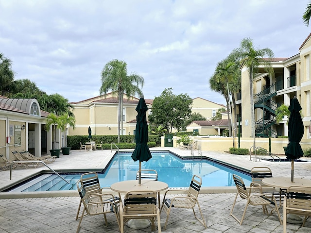 view of swimming pool with a patio area