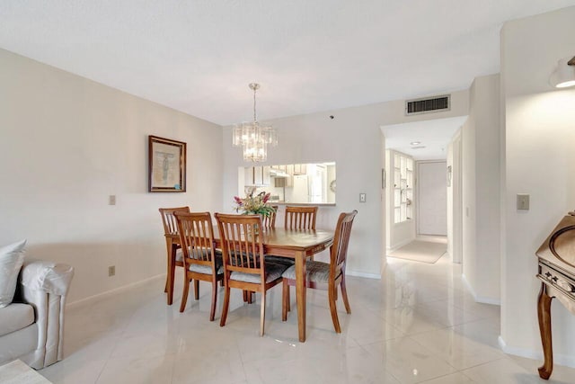 dining room featuring an inviting chandelier