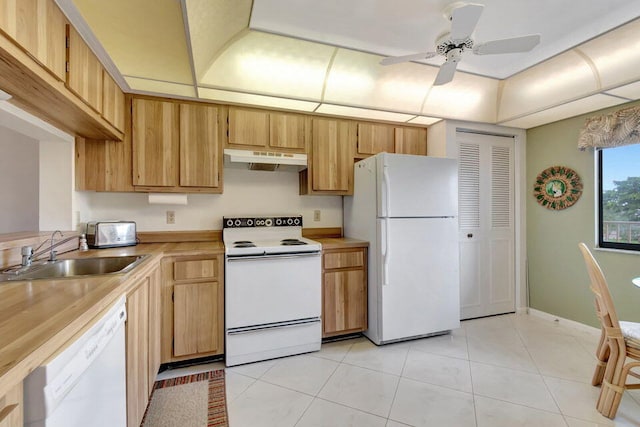 kitchen featuring ceiling fan, sink, light tile patterned floors, and white appliances