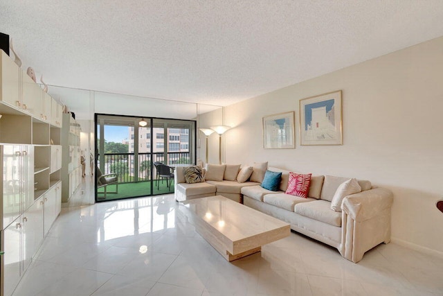 living room with light tile patterned floors and a textured ceiling