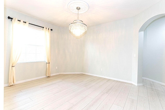 spare room featuring light hardwood / wood-style flooring