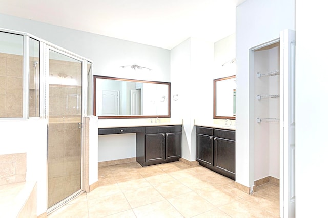 bathroom featuring vanity, shower with separate bathtub, and tile patterned floors