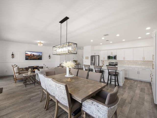 dining space featuring dark hardwood / wood-style floors