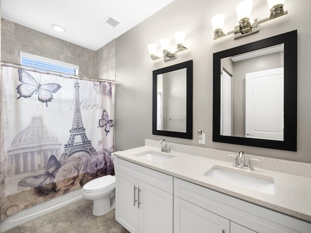 bathroom with toilet, curtained shower, vanity, and tile patterned flooring