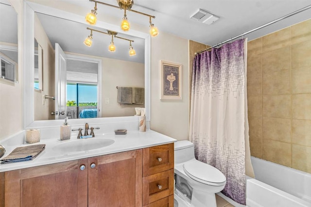 full bathroom with vanity, toilet, and shower / tub combo with curtain