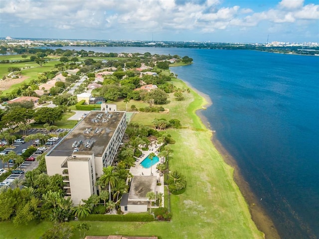 birds eye view of property featuring a water view and a beach view