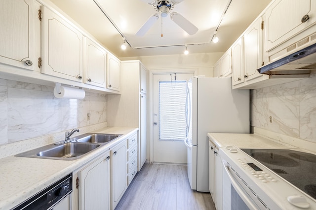 kitchen featuring white cabinets, decorative backsplash, and dishwasher