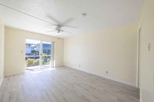 bedroom with a textured ceiling, light wood-type flooring, and ceiling fan